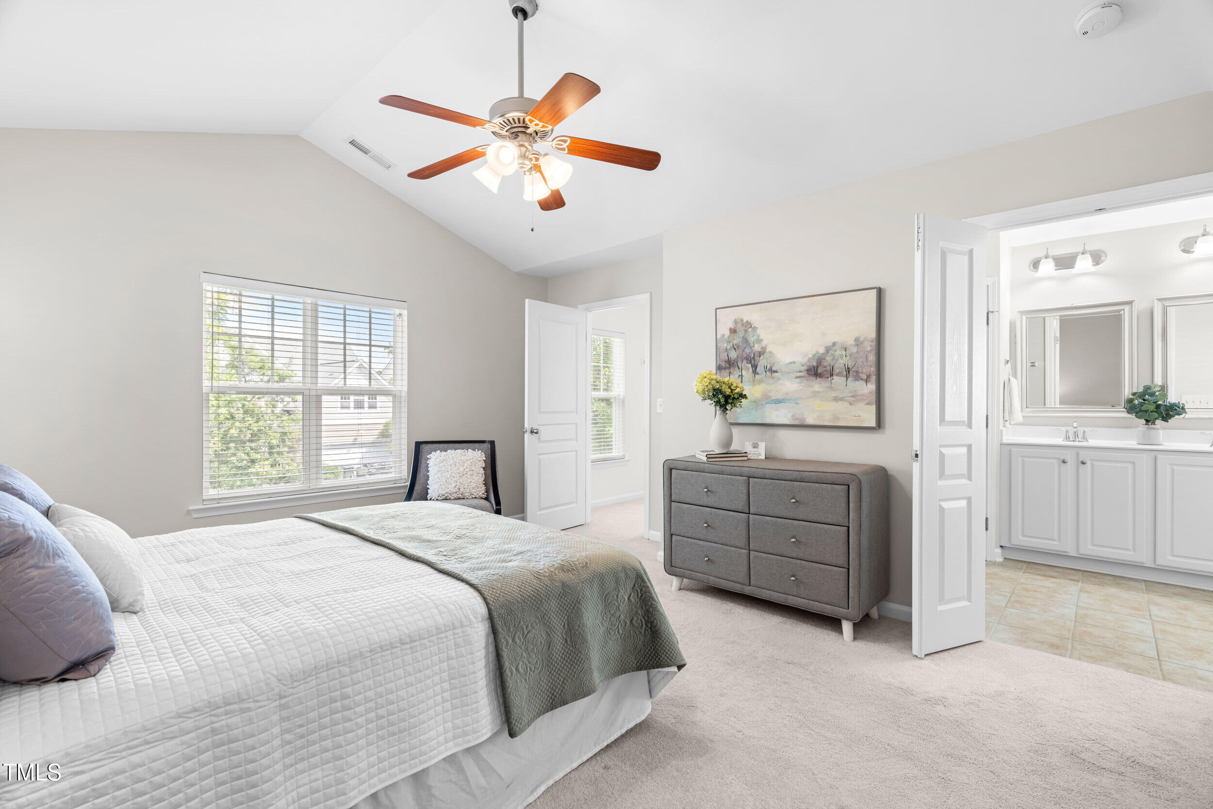 2816 Prospect Parkway Durham, NC 27703 - Photo 21 of 38 a bedroom with a bed and a chandelier