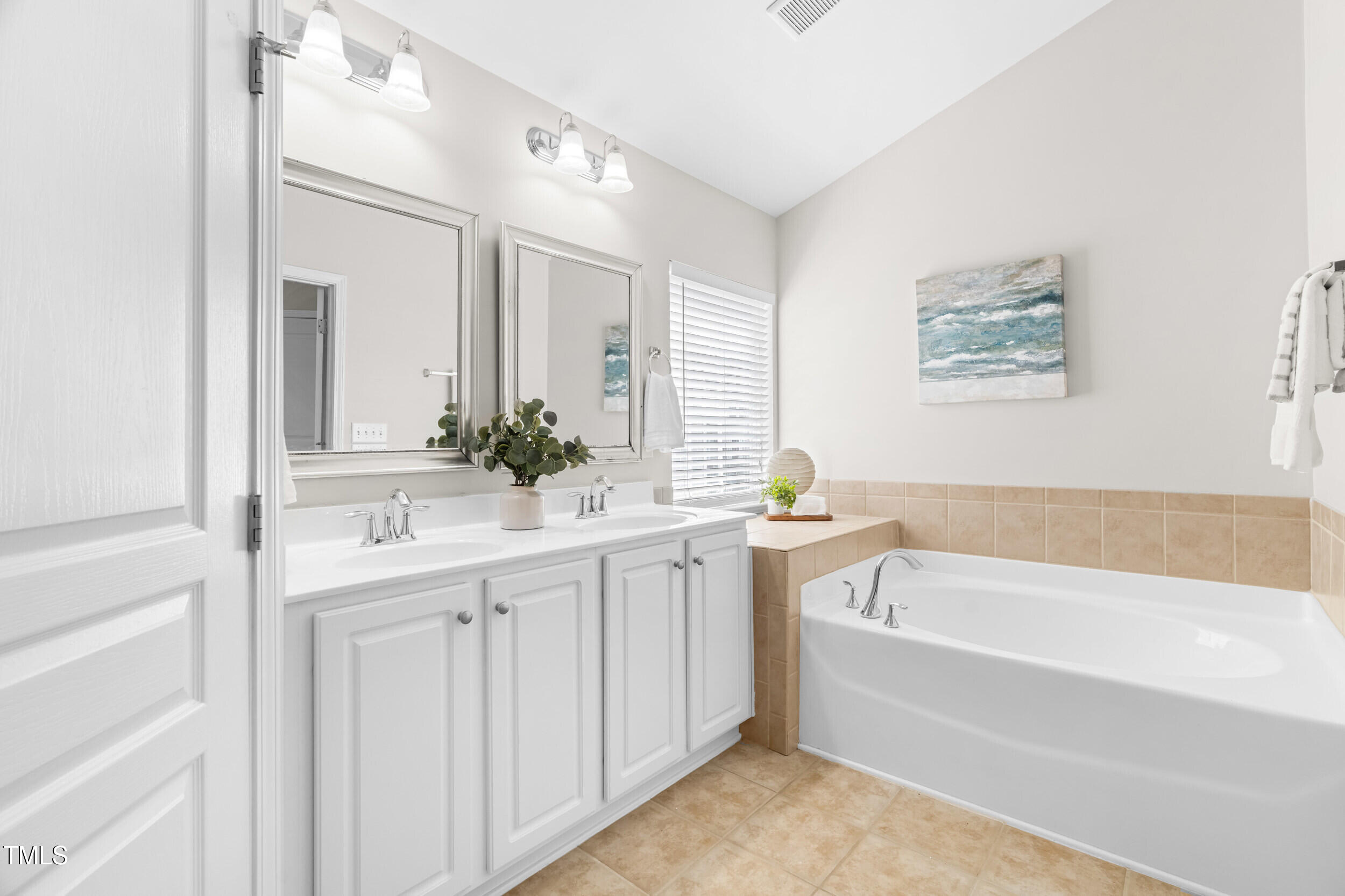 2816 Prospect Parkway Durham, NC 27703 - Photo 24 of 38 a bathroom with a bathtub a sink and a window