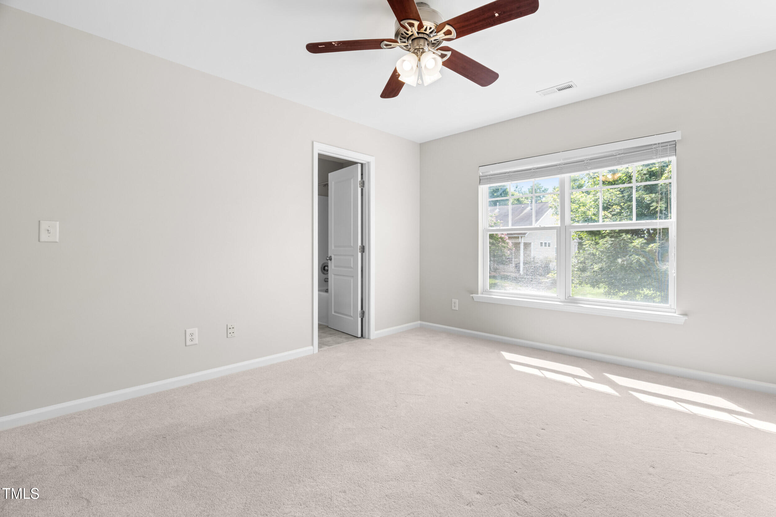 2816 Prospect Parkway Durham, NC 27703 - Photo 29 of 38 an empty room with a window and a fan