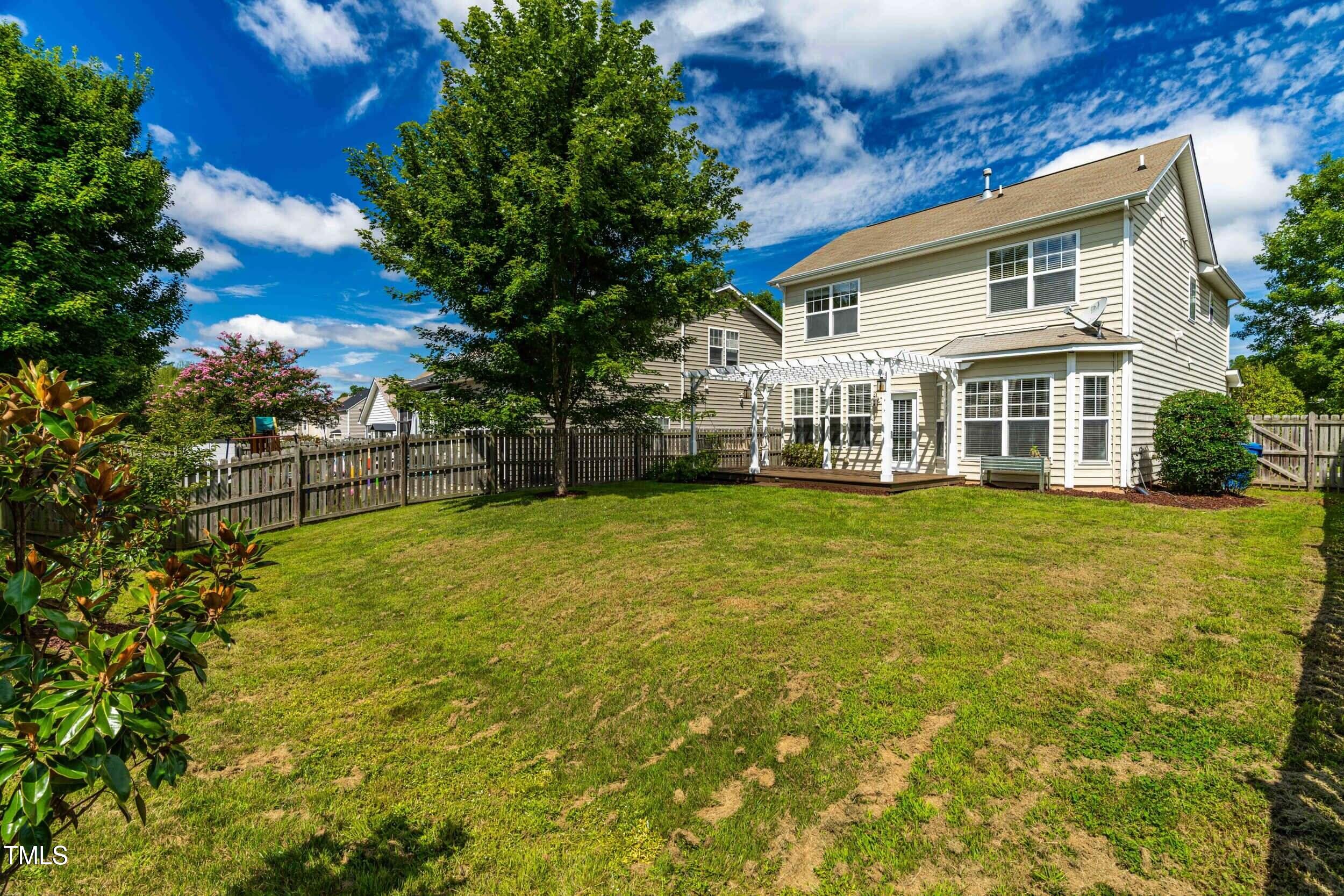2816 Prospect Parkway Durham, NC 27703 - Photo 37 of 38 a front view of a house with a yard table and chairs