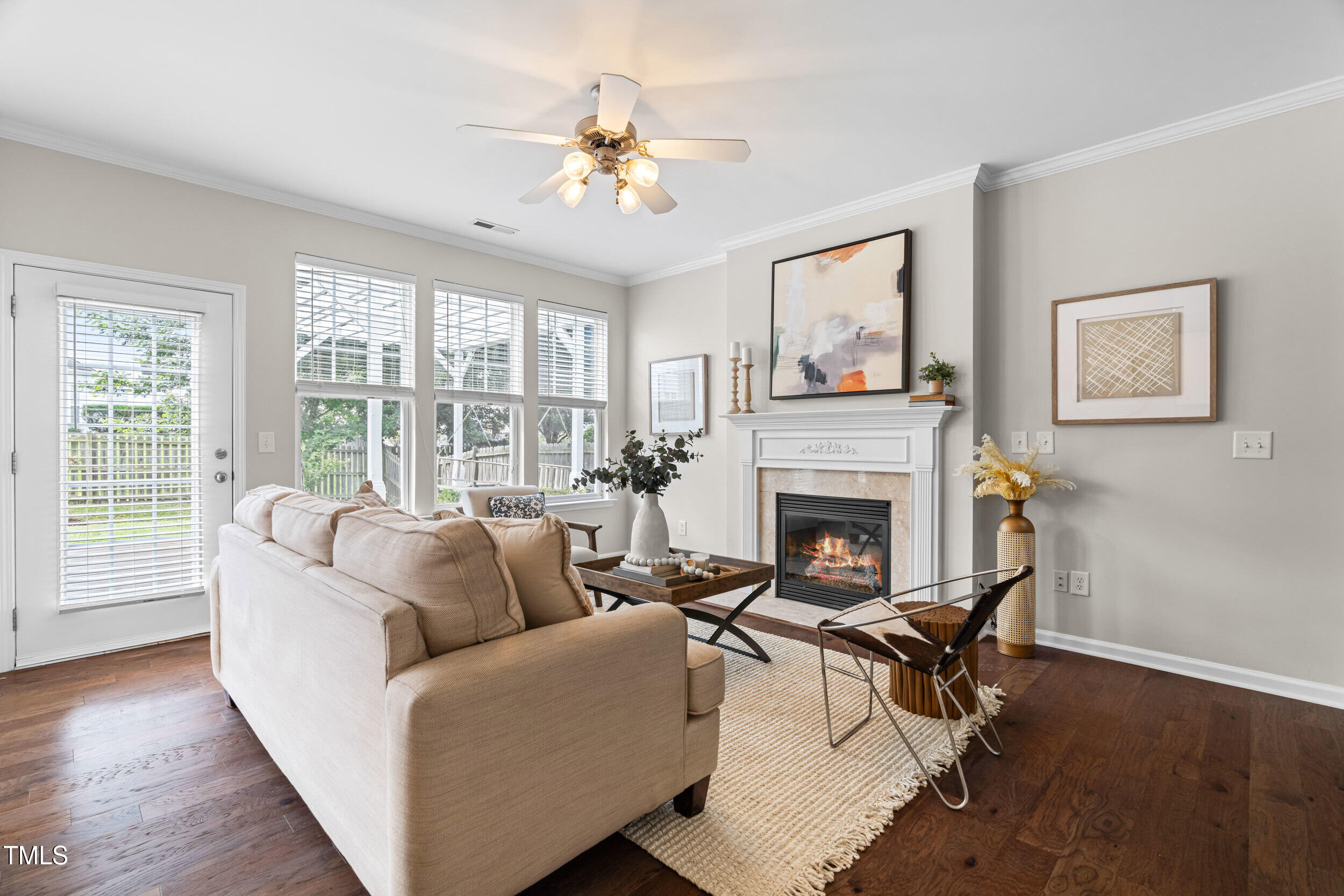 2816 Prospect Parkway Durham, NC 27703 - Photo 6 of 38 a living room with furniture a fireplace and a large window