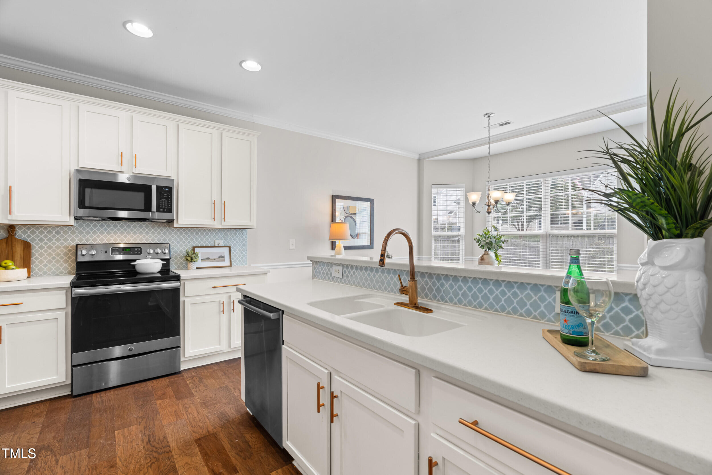 2816 Prospect Parkway Durham, NC 27703 - Photo 9 of 38 a kitchen with sink a microwave and stove