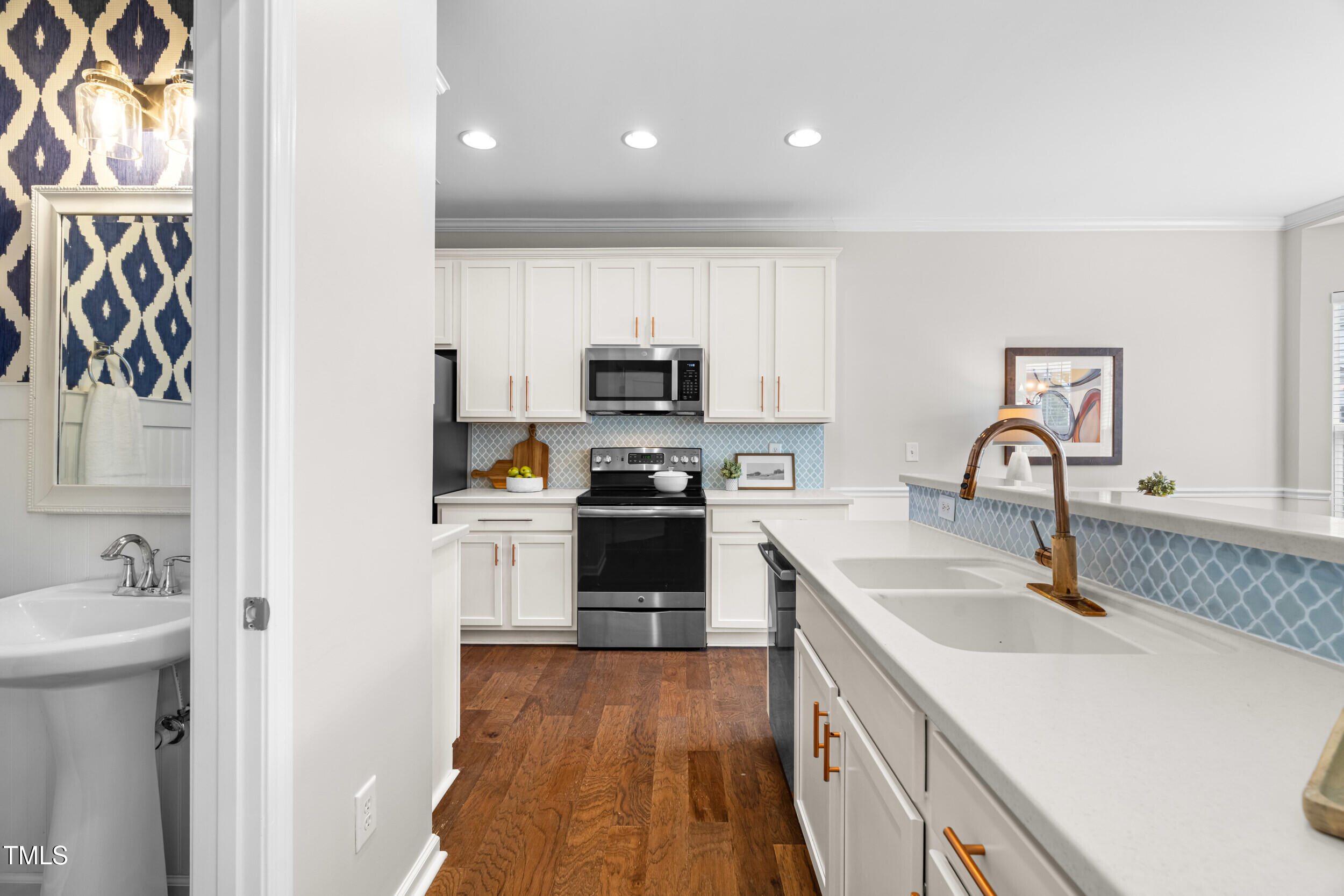2816 Prospect Parkway Durham, NC 27703 - Photo 10 of 38 a kitchen with a sink cabinets and a stove