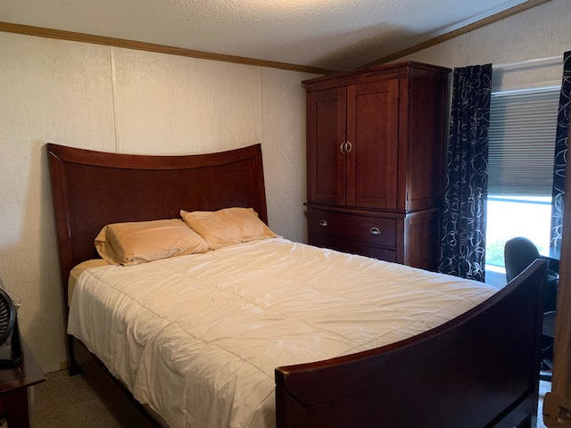 819 South 9th Street DeKalb, IL 60115 - Photo 11 of 20 a bedroom with a bed and wooden floor