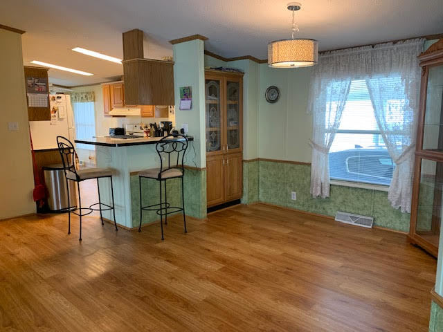819 South 9th Street DeKalb, IL 60115 - Photo 5 of 20 a open kitchen with stainless steel appliances granite countertop a granite counter tops and a wooden floors