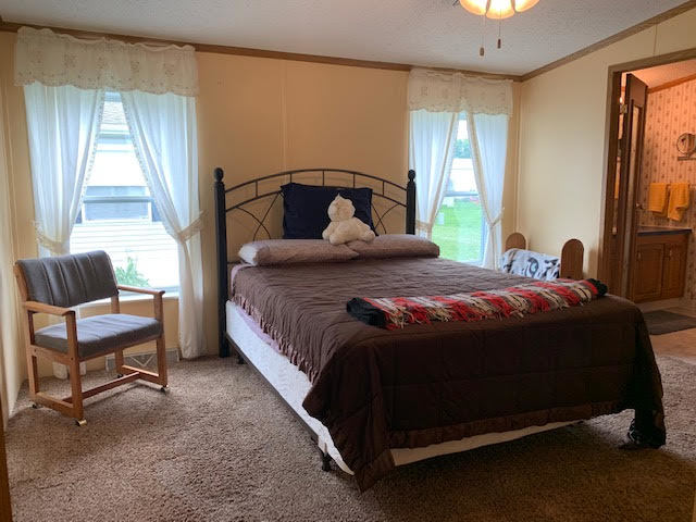 819 South 9th Street DeKalb, IL 60115 - Photo 9 of 20 a bedroom with a bed chair and window