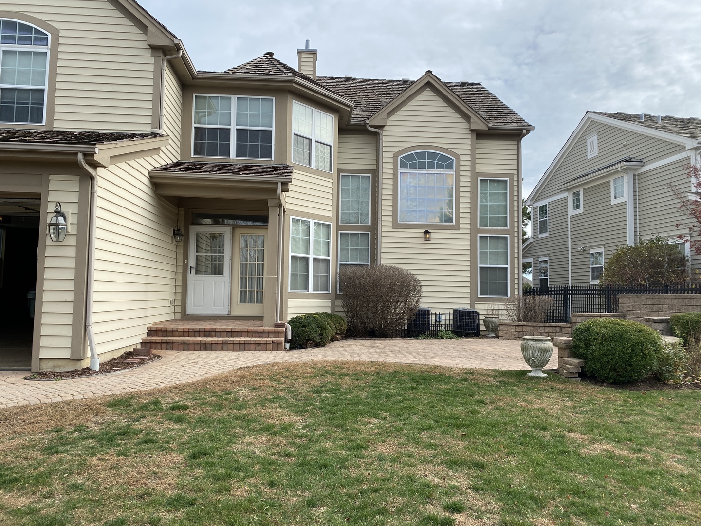 1686 Constitution Drive Glenview, IL 60026 - Photo 18 of 22 a view of a house with a small yard and a large window