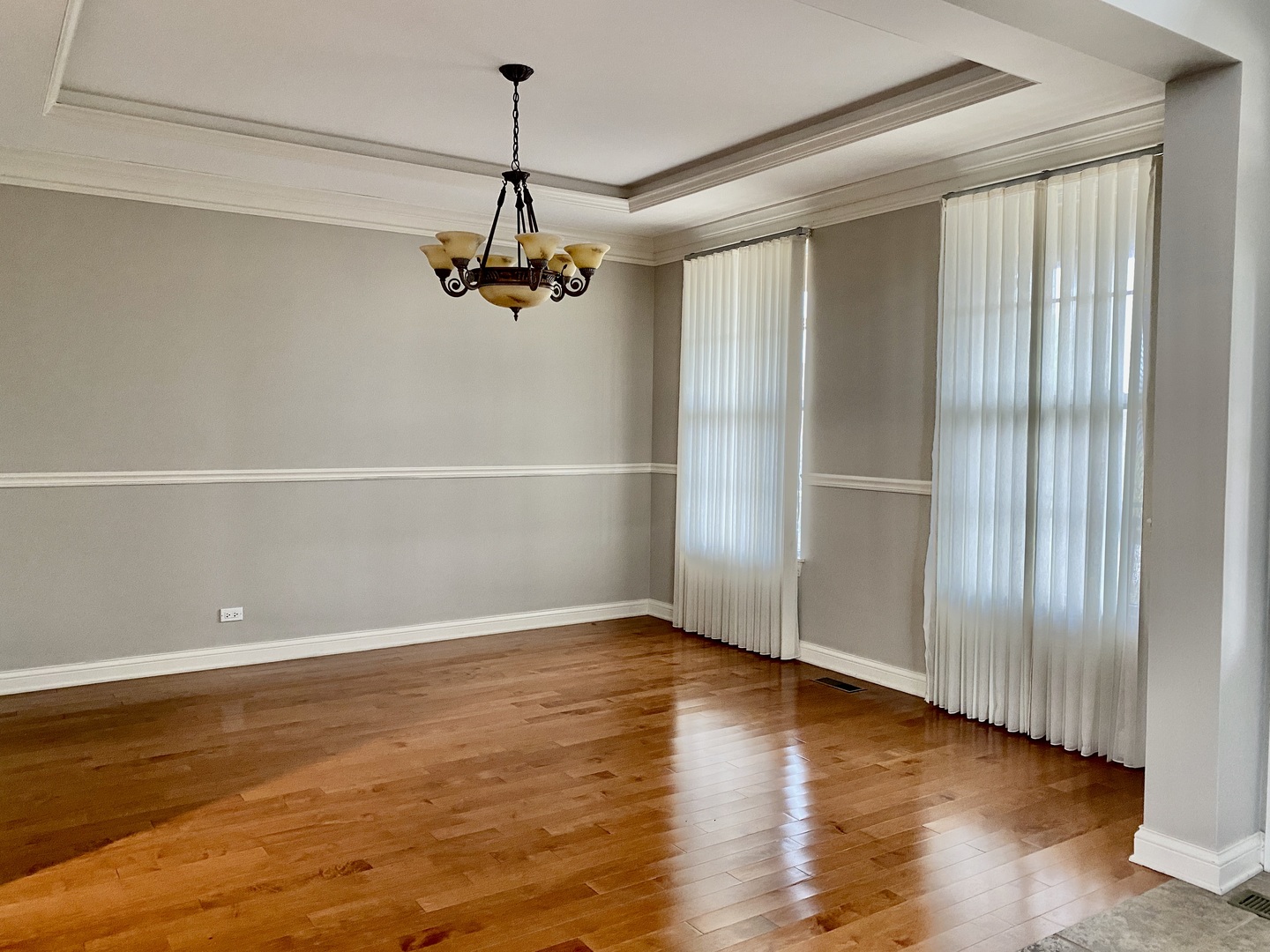 1686 Constitution Drive Glenview, IL 60026 - Photo 4 of 22 a view of a room with wooden floor fridge and staircase