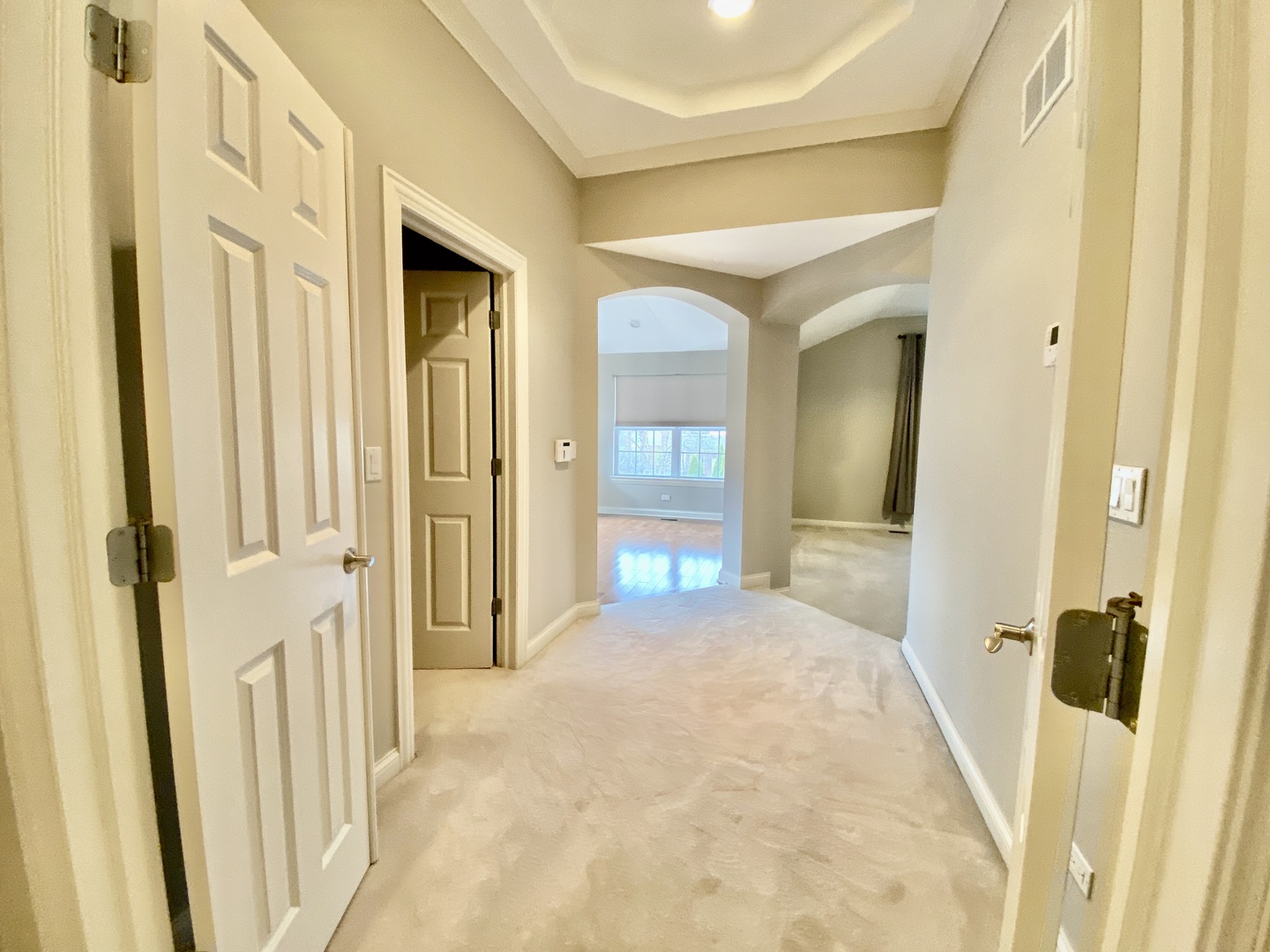 1686 Constitution Drive Glenview, IL 60026 - Photo 10 of 22 a view of a hallway with wooden floor and staircase