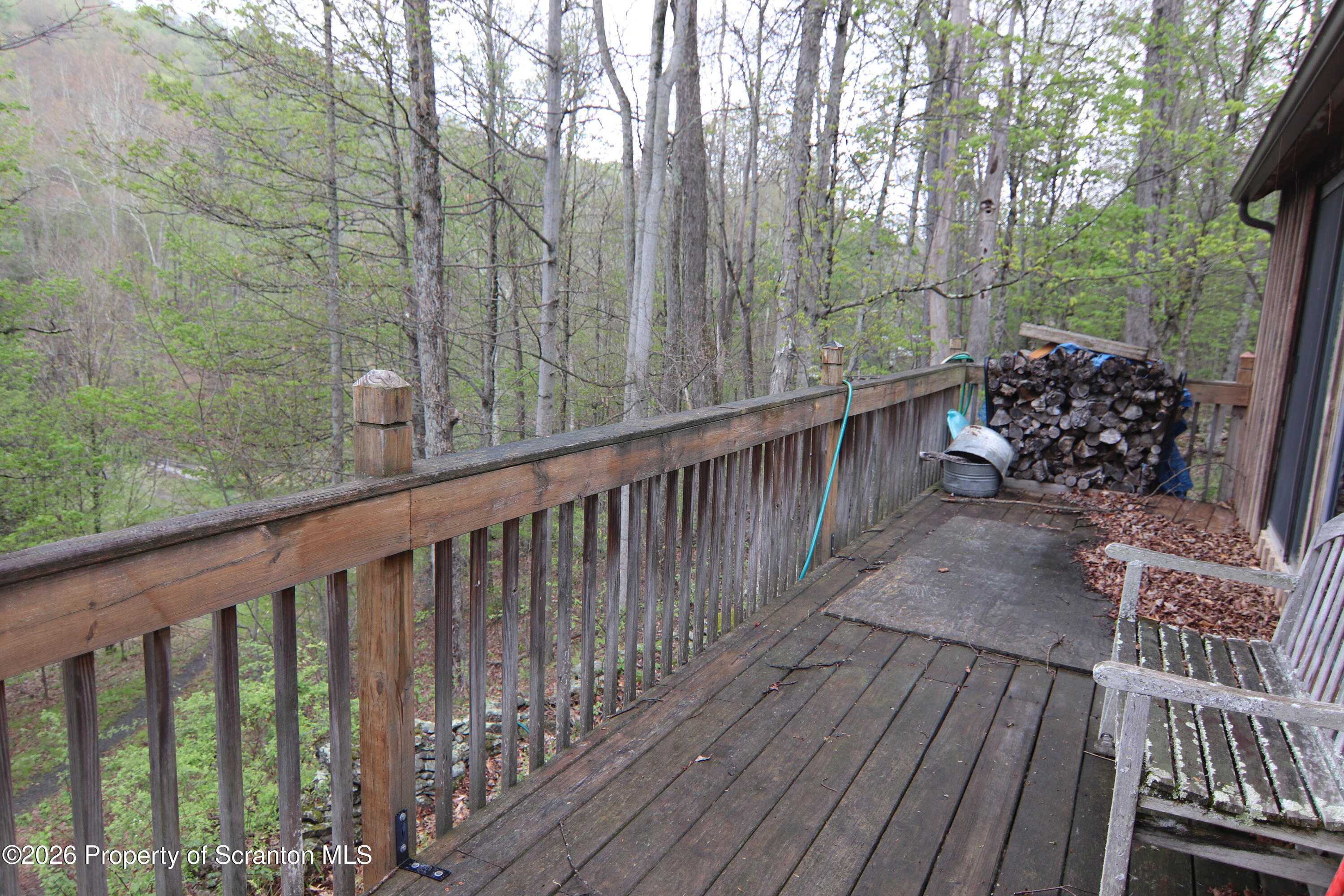 300 Pennsworth Hill Road Meshoppen, PA 18630 - Photo 7 of 38 a balcony with wooden floor and trees