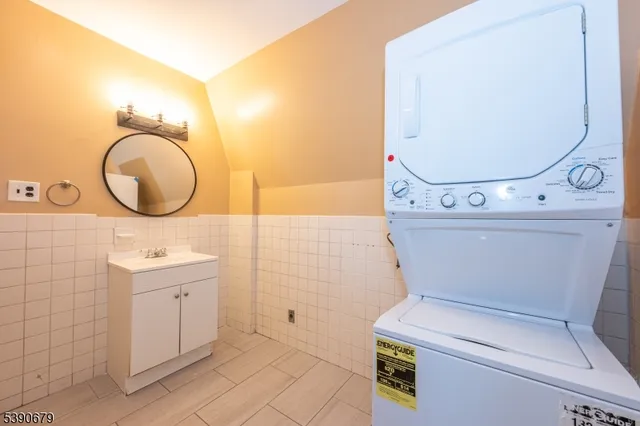 a bathroom with a sink mirror and vanity