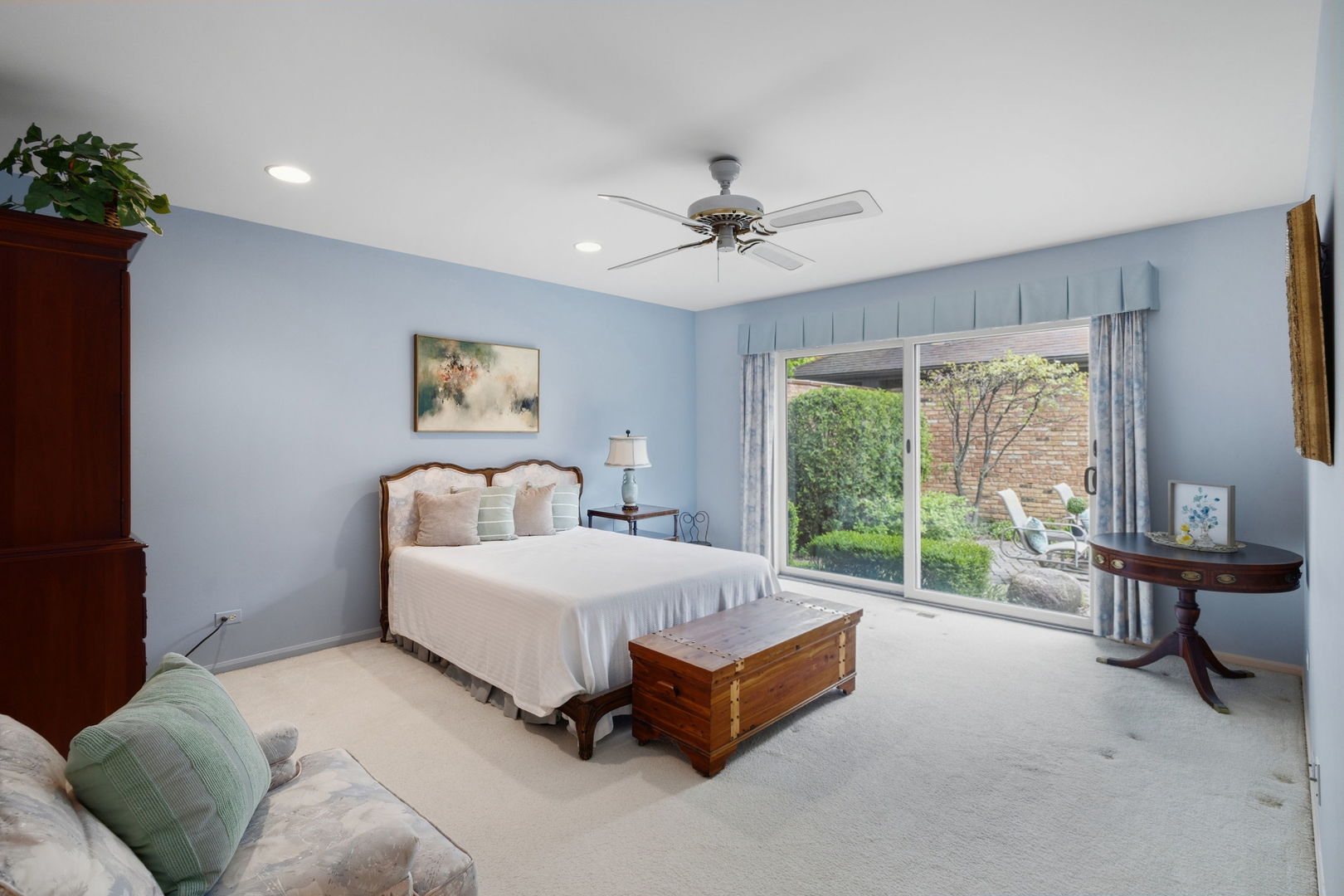 715 Tomlin Drive, Unit A1 Burr Ridge, IL 60527 - Photo 15 of 24 a bed room with a bed and a large window