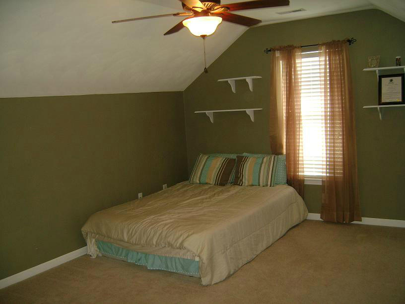 1741 Meadows Road Vinton, VA 24179 - Photo 12 of 23 a bedroom with a bed and a chandelier