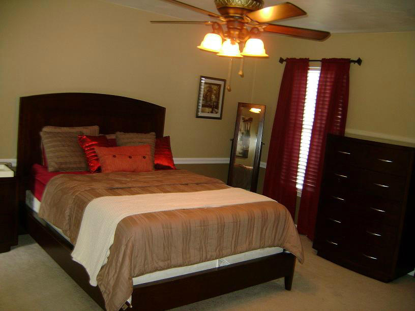 1741 Meadows Road Vinton, VA 24179 - Photo 15 of 23 a bedroom with a bed and a chandelier