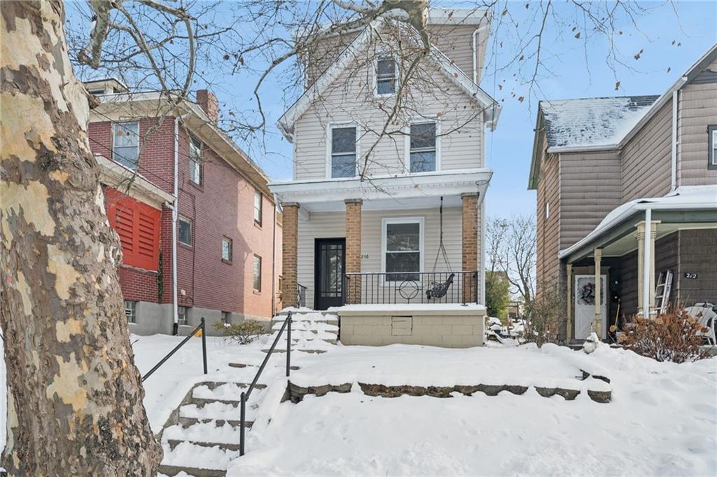 216 Whipple Street Pittsburgh, PA 15218 - Photo 1 of 29 a view of a white building with large windows