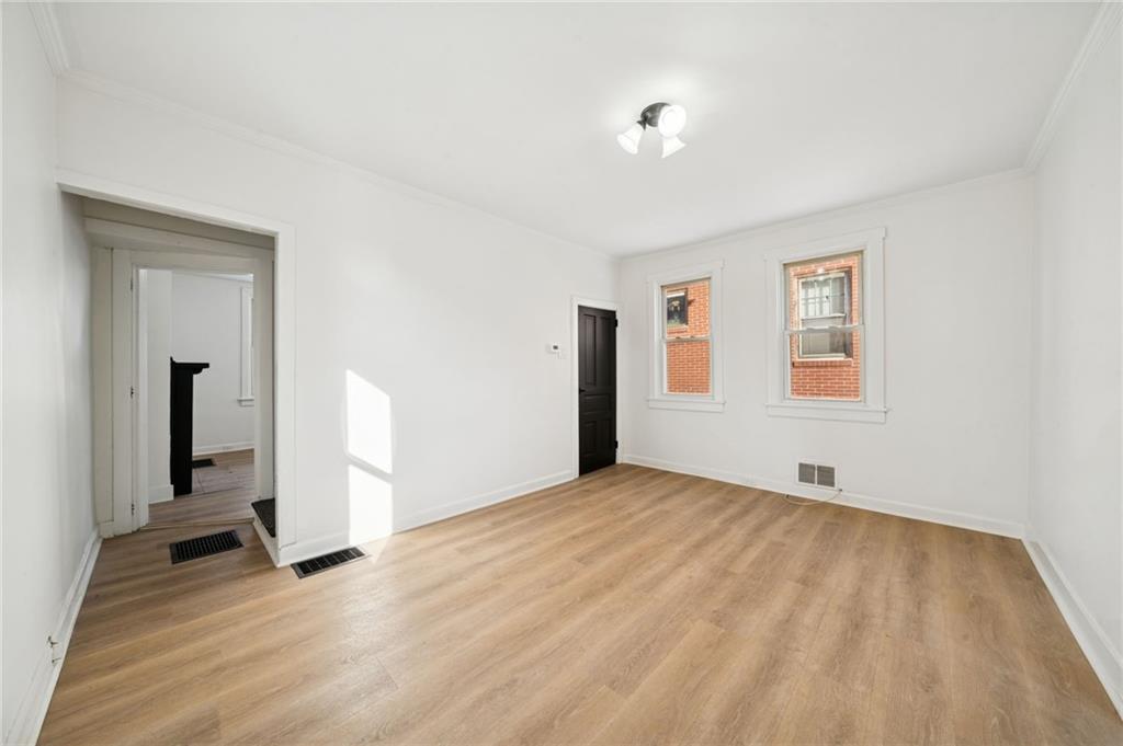216 Whipple Street Pittsburgh, PA 15218 - Photo 13 of 29 a view of empty room with wooden floor