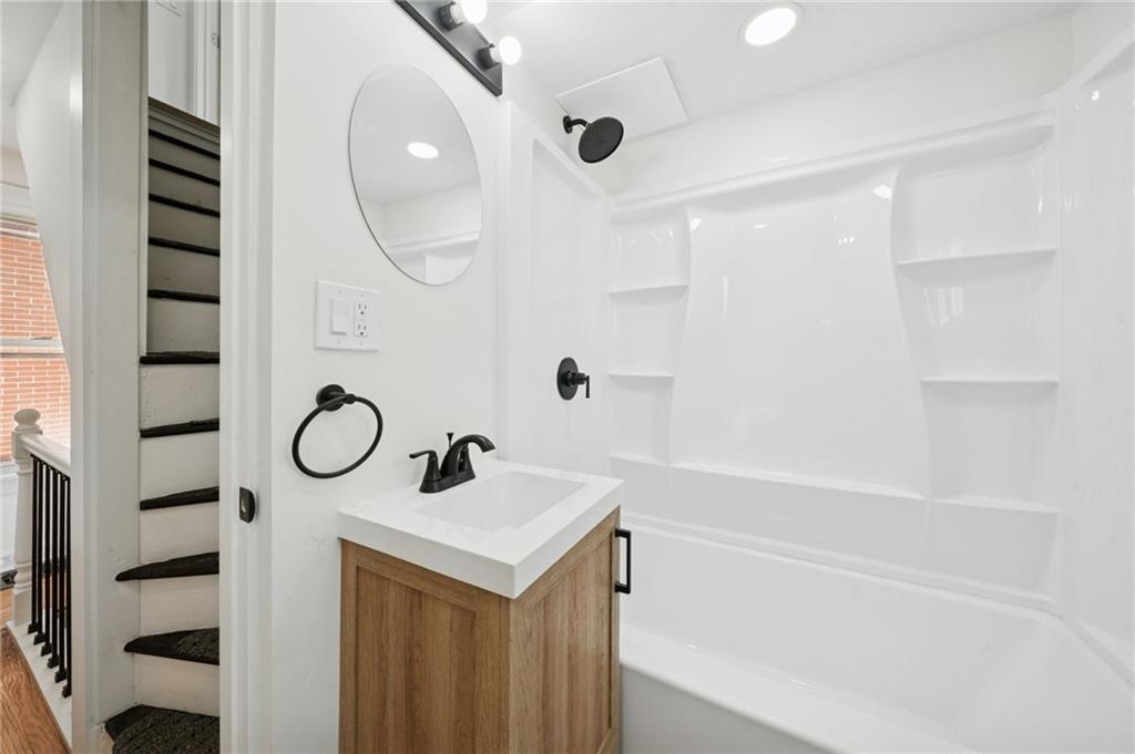 216 Whipple Street Pittsburgh, PA 15218 - Photo 14 of 29 a bathroom with a sink and a mirror