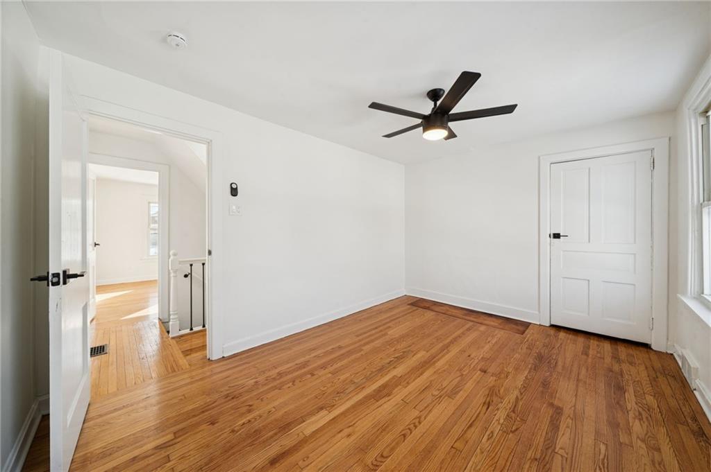 216 Whipple Street Pittsburgh, PA 15218 - Photo 17 of 29 wooden floor in an empty room