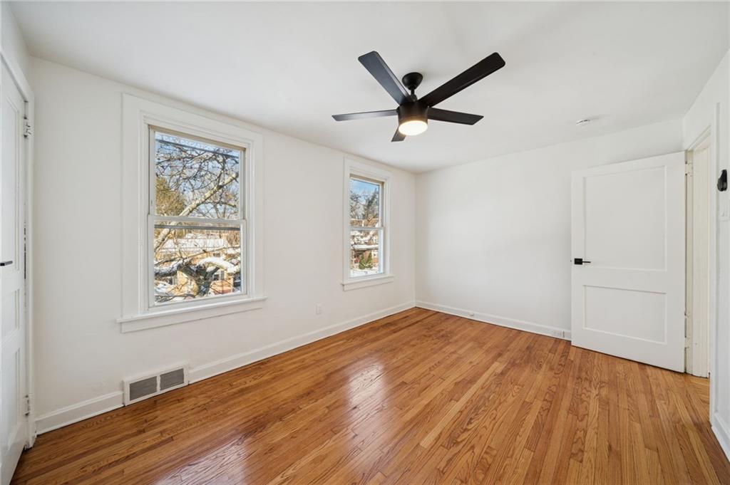 216 Whipple Street Pittsburgh, PA 15218 - Photo 18 of 29 a view of empty room with wooden floor and window