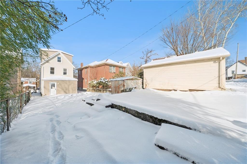 216 Whipple Street Pittsburgh, PA 15218 - Photo 24 of 29 a view of residential house with wooden fence