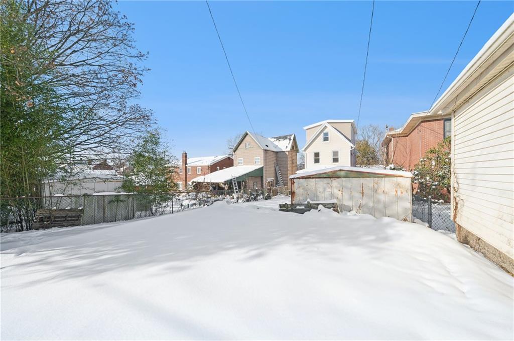216 Whipple Street Pittsburgh, PA 15218 - Photo 25 of 29 a view of a building with snow on the road