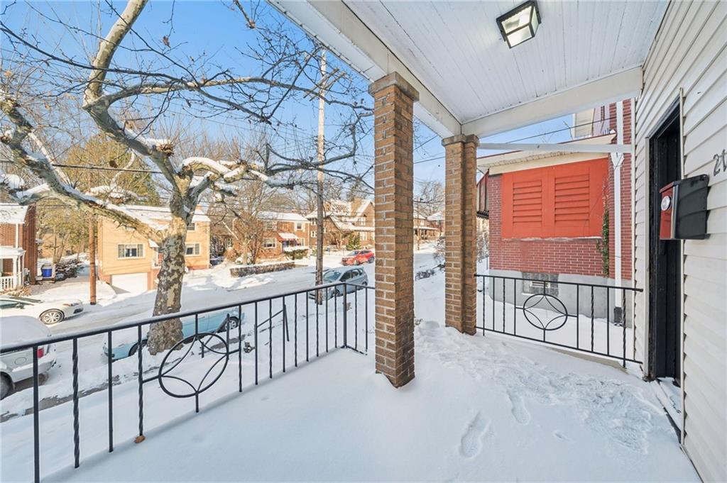 216 Whipple Street Pittsburgh, PA 15218 - Photo 3 of 29 a view of a porch with a floor to ceiling window