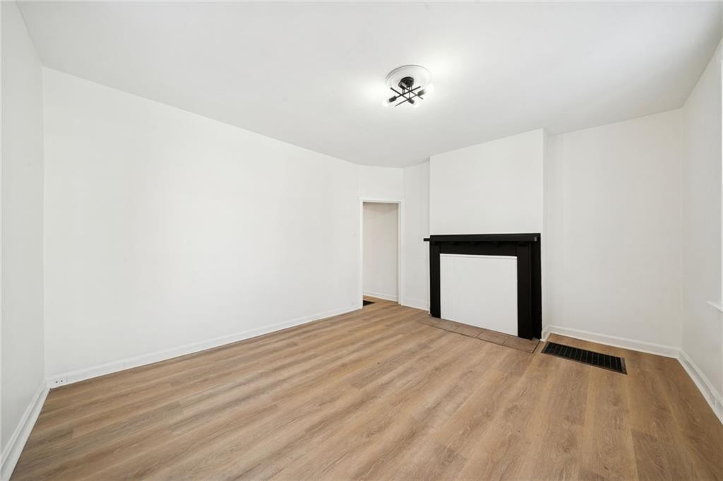 216 Whipple Street Pittsburgh, PA 15218 - Photo 8 of 29 a view of an empty room and wooden floor