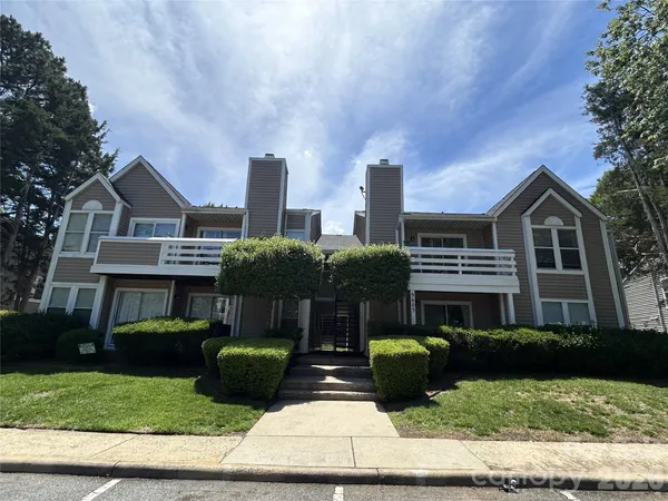 a view of house and yard with green space