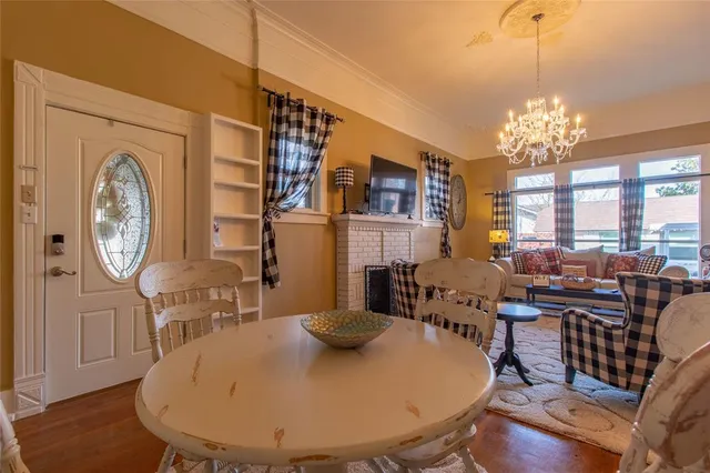 a view of a livingroom with furniture window and wooden floor