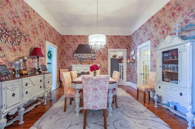 a view of a dining room with furniture and chandelier
