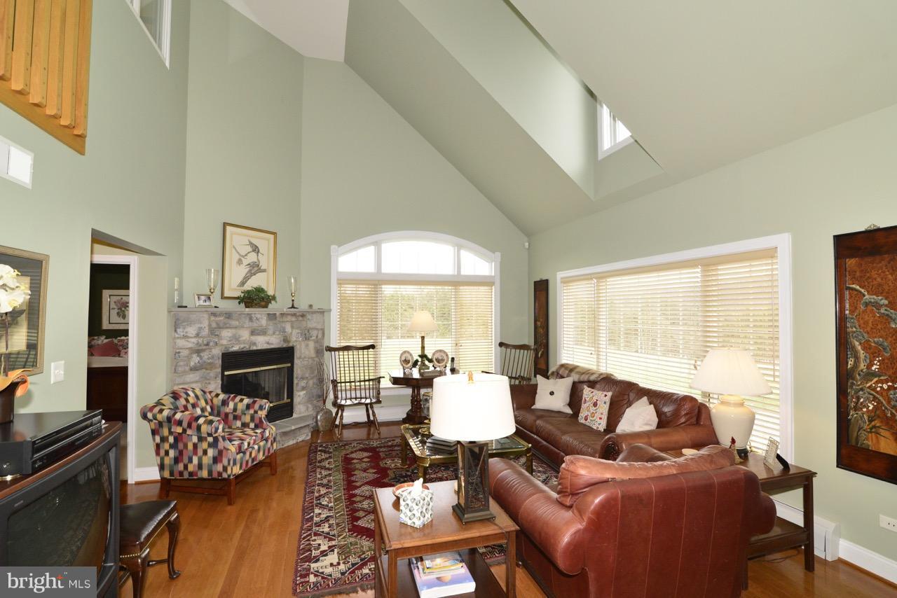 3056 Swift Shoals Road Boyce, VA 22620 - Photo 14 of 29 a living room with furniture fireplace and a large window