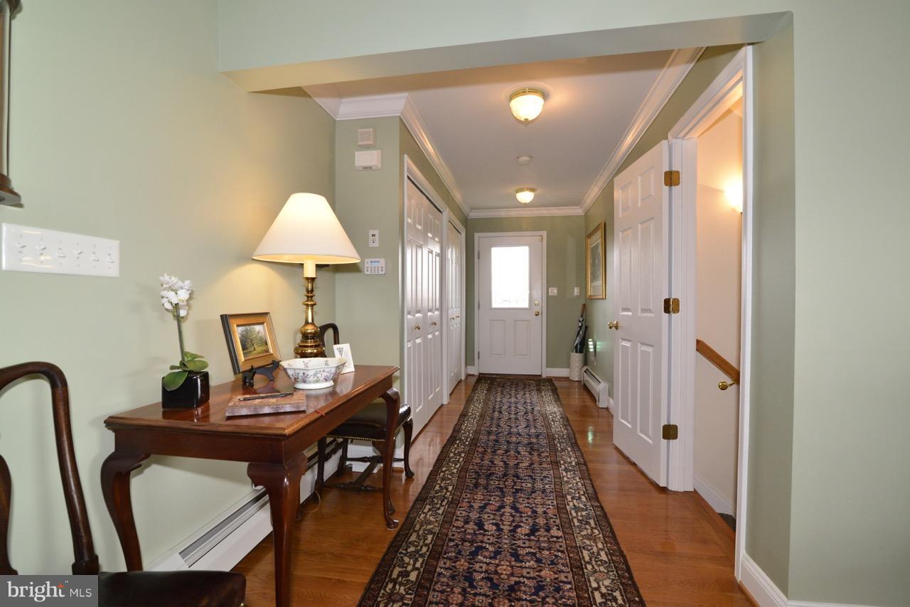 3056 Swift Shoals Road Boyce, VA 22620 - Photo 7 of 29 a view of a hallway to a livingroom with furniture and wooden floor