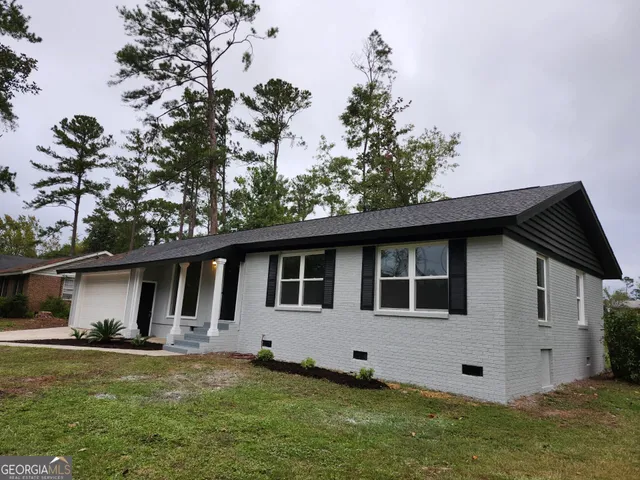 a house view with a garden space