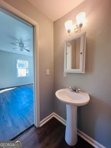 a bathroom with a sink and mirror