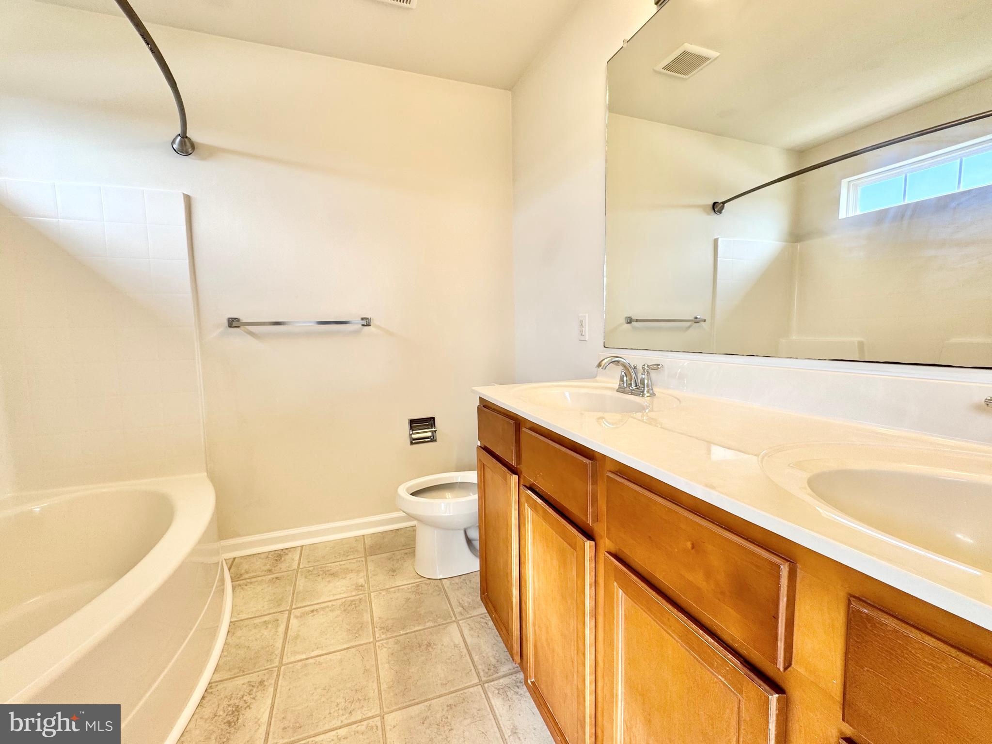 56 Nicholas Drive Dover, DE 19901 - Photo 16 of 23 a bathroom with a sink a toilet and bathtub