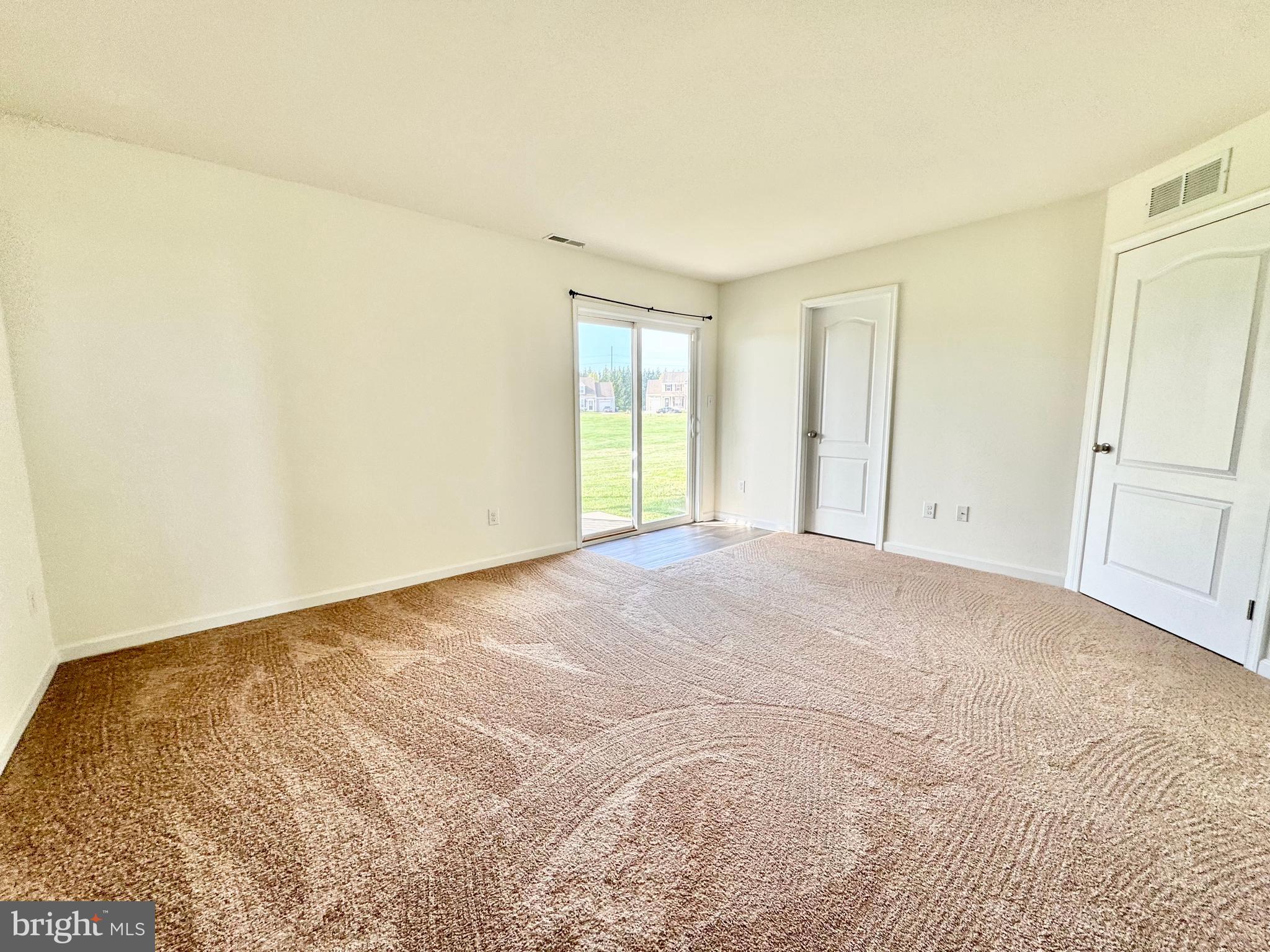 56 Nicholas Drive Dover, DE 19901 - Photo 19 of 23 a view of an empty room with a window