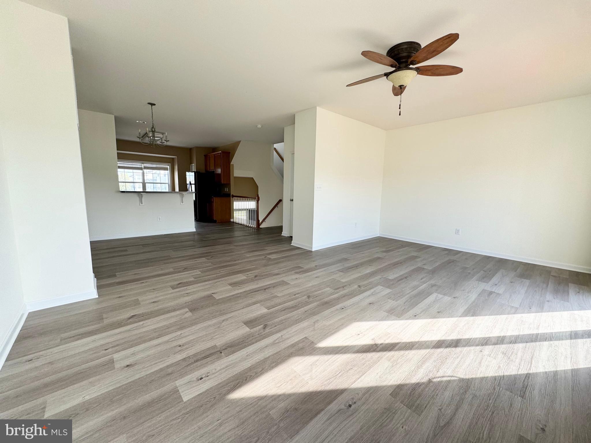 56 Nicholas Drive Dover, DE 19901 - Photo 4 of 23 wooden floor in an empty room with a window