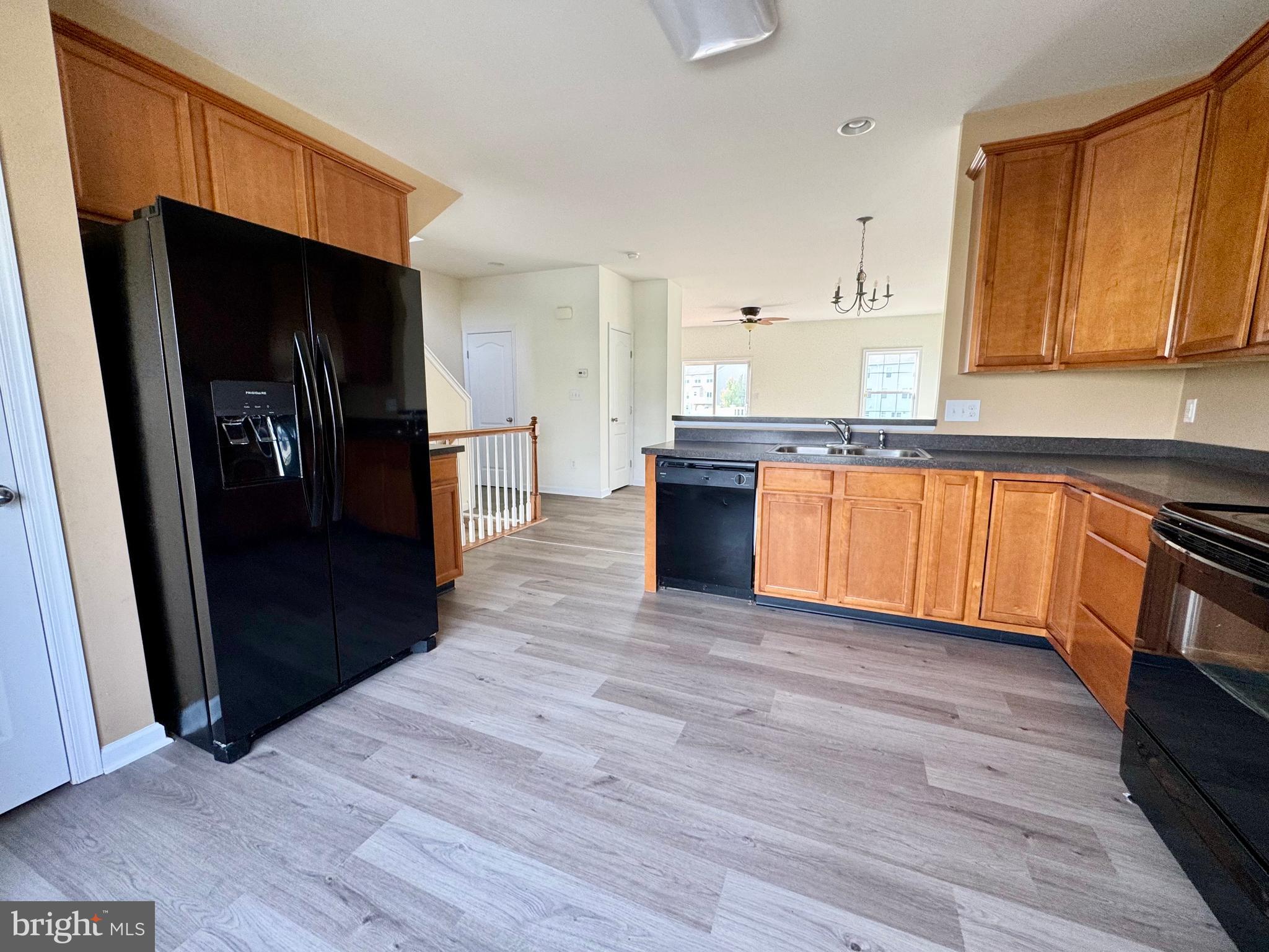 56 Nicholas Drive Dover, DE 19901 - Photo 6 of 23 a kitchen with stainless steel appliances granite countertop a refrigerator and a sink