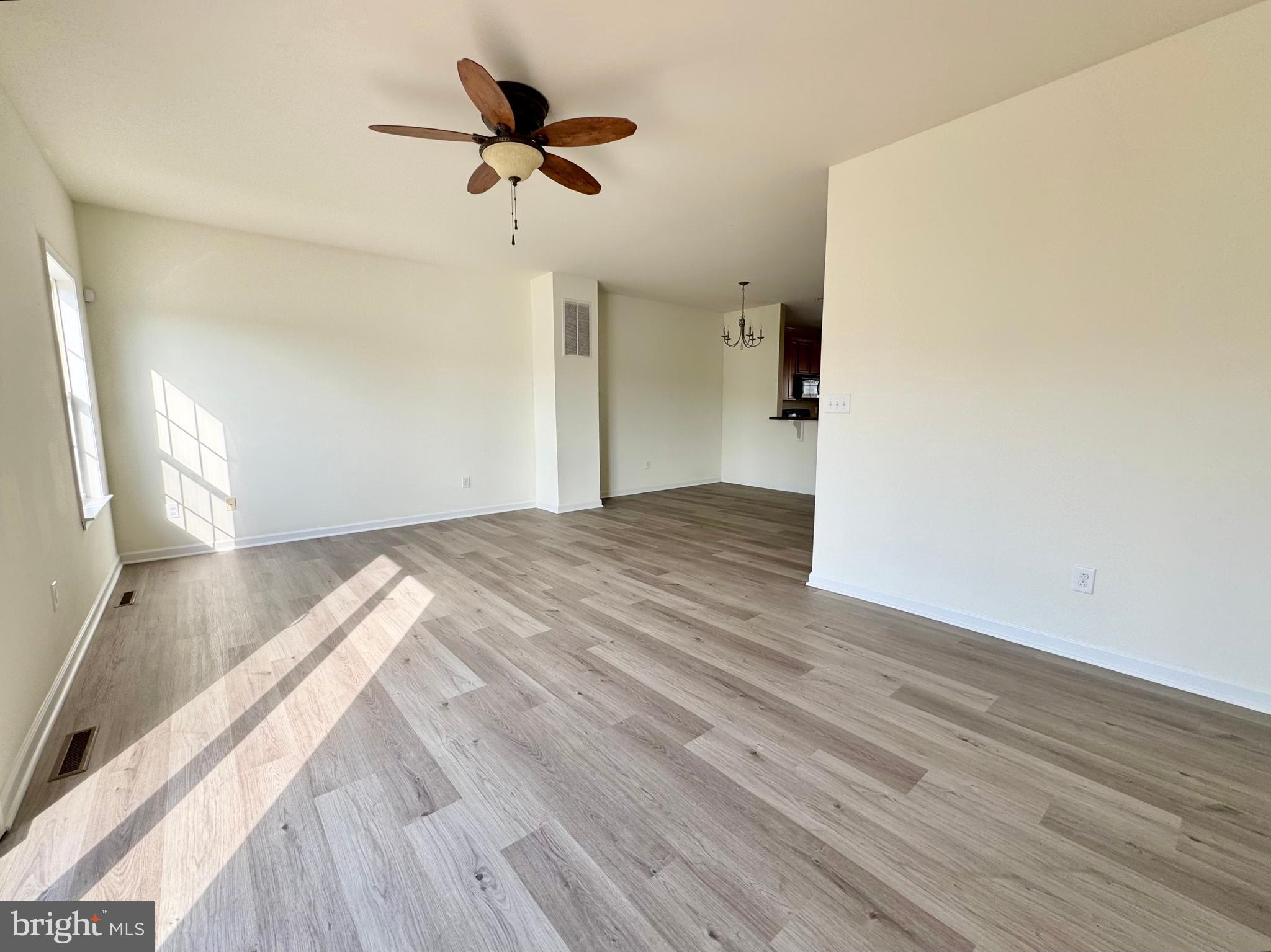 56 Nicholas Drive Dover, DE 19901 - Photo 8 of 23 a view of a room with wooden floor and a ceiling fan