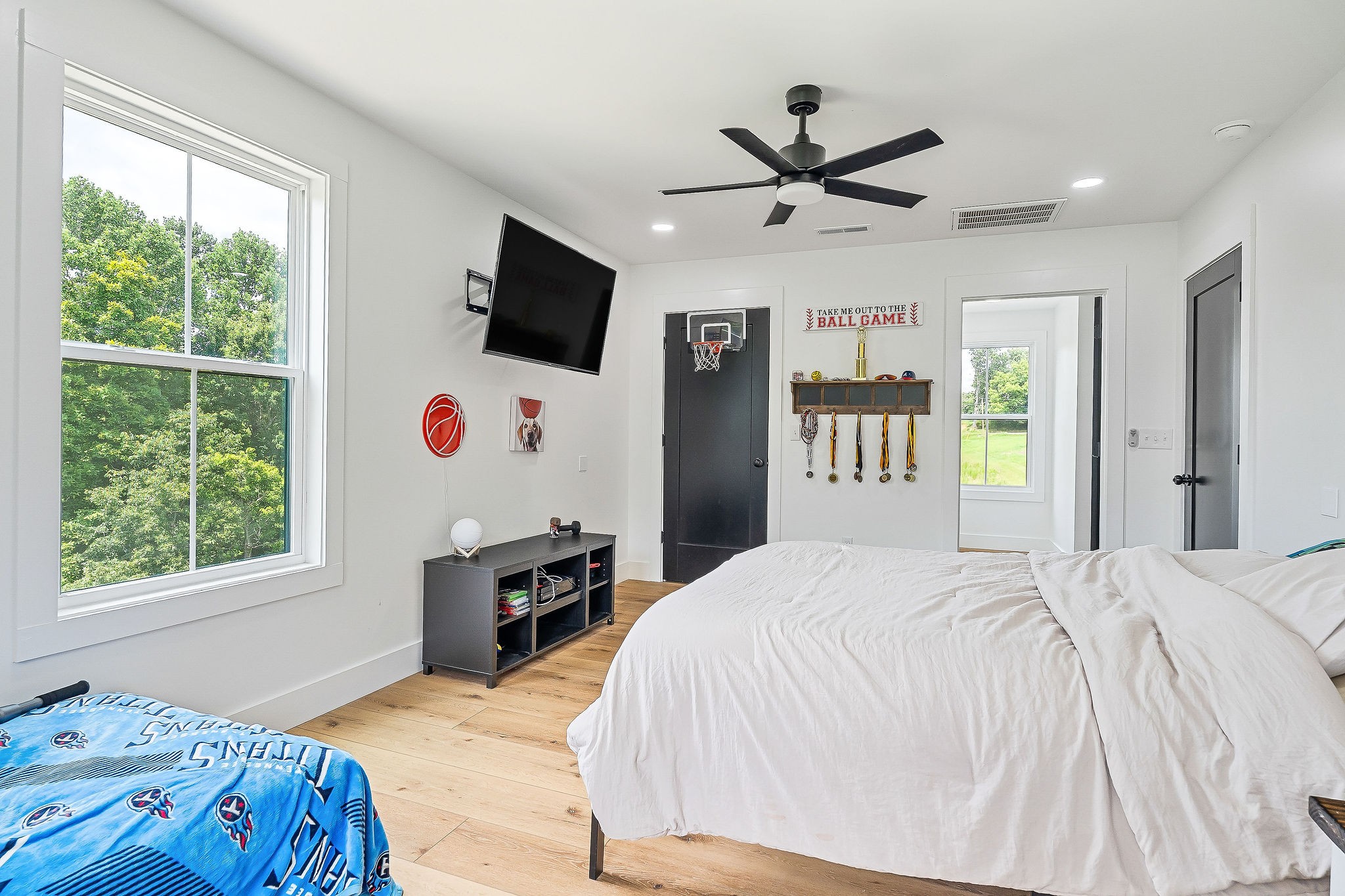 250 Dyer Ridge Road Baxter, TN 38544 - Photo 28 of 45 a bedroom with a bed and a chandelier