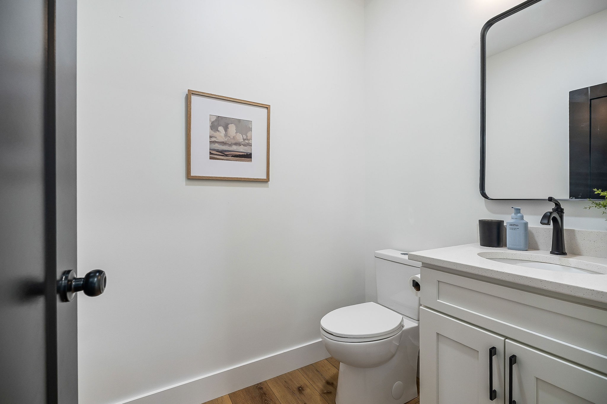 250 Dyer Ridge Road Baxter, TN 38544 - Photo 7 of 44 a bathroom with a toilet sink vanity and mirror