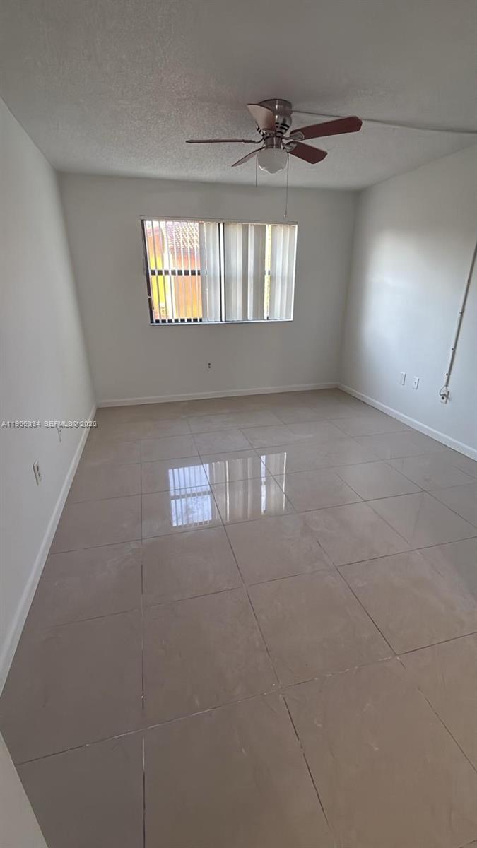 15620 Southwest 80th Street, Unit H203 Miami, FL 33193 - Photo 6 of 11 a view of an empty room and window