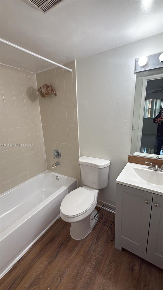 15620 Southwest 80th Street, Unit H203 Miami, FL 33193 - Photo 10 of 11 a bathroom with a toilet a sink and bathtub