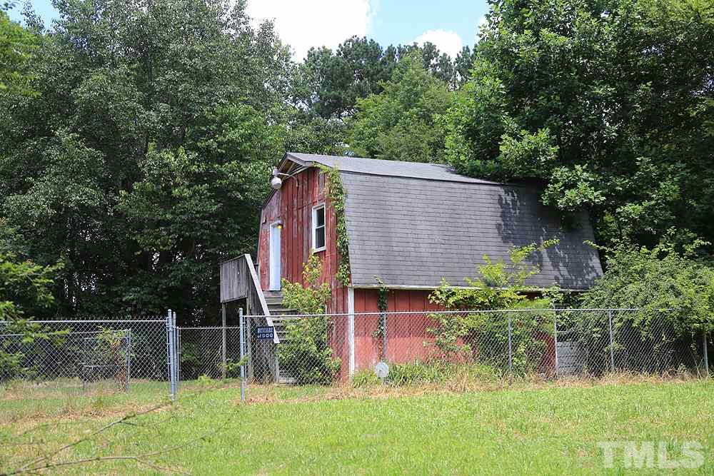 721 Beasley Road Louisburg, NC 27549 - Photo 3 of 4 This barn was used by original owners as a home while building, so the upstairs is finished with H2O, electric and potential to add a bath for a guest/caretaker home or rental! Downstairs is open storage and needs TLC!