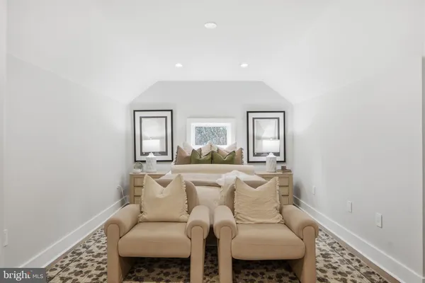a living room with furniture and white walls