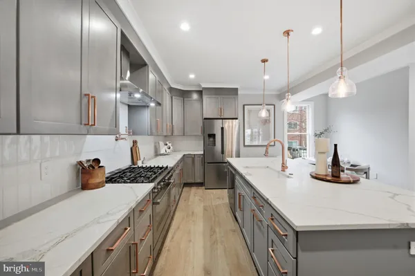 a view of a hallway with paintings on the wall