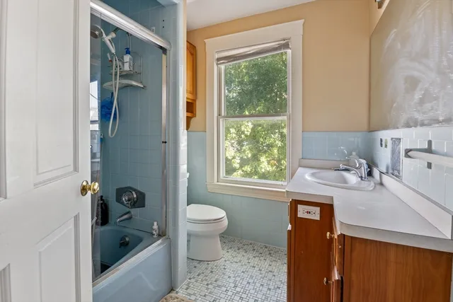 a bathroom with a sink a bathtub and a shower