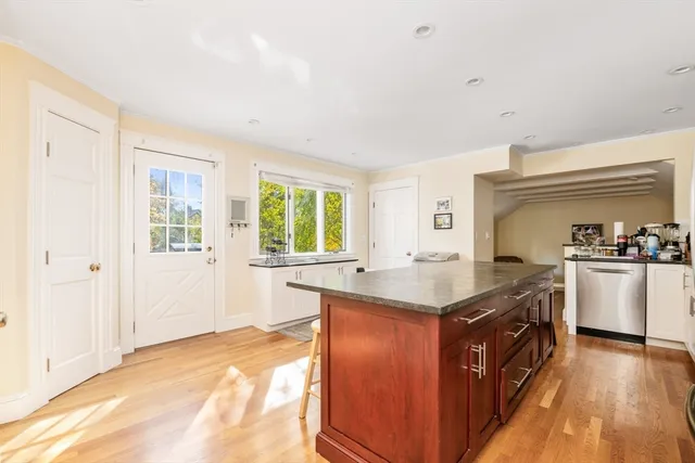a kitchen with granite countertop a sink a counter top space and appliances