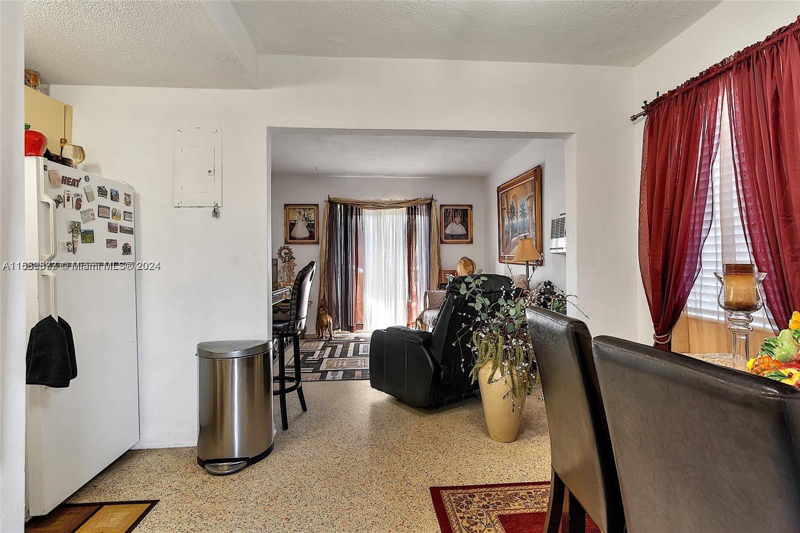 1361 Southwest 4th Street Miami, FL 33135 - Photo 14 of 14 a living room with furniture a window and gym equipment