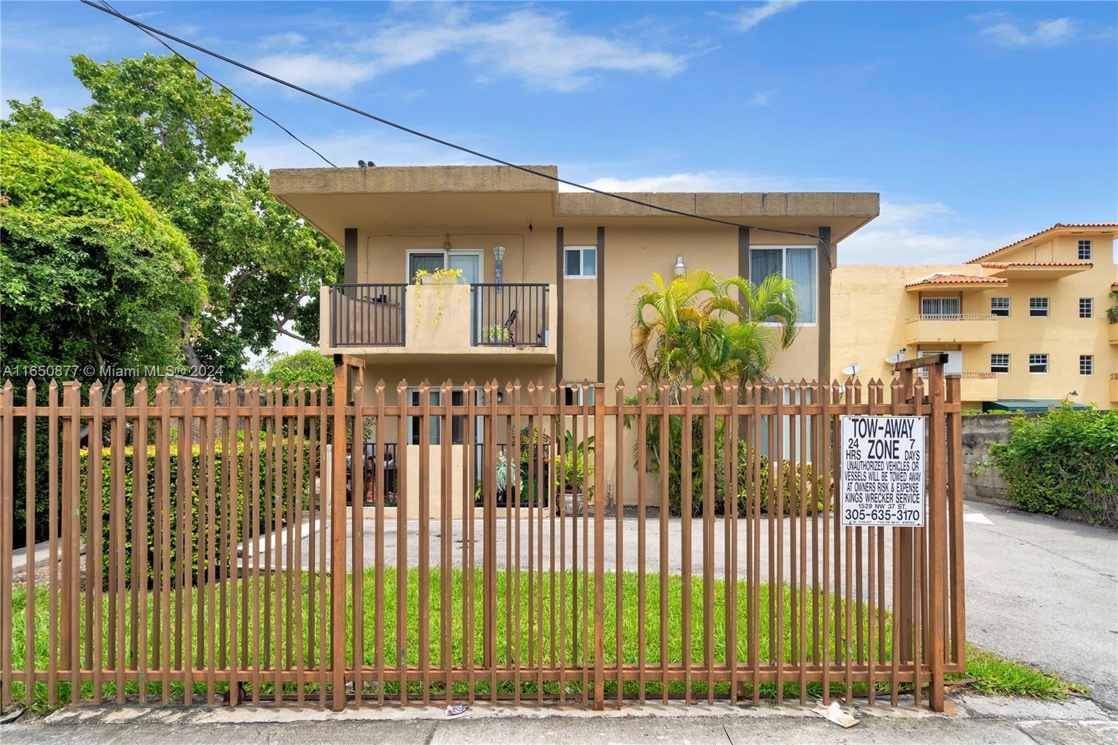 1361 Southwest 4th Street Miami, FL 33135 - Photo 2 of 14 a view of a house with a wooden fence